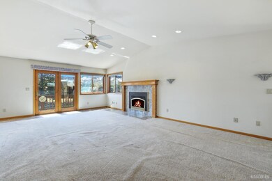 Large upstairs living room with gas insert and beautiful Mt. Tallac views