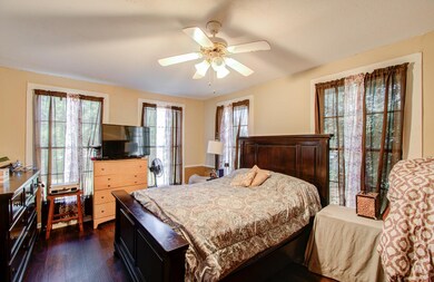 Spacious primary bedroom featuring stunning floor-