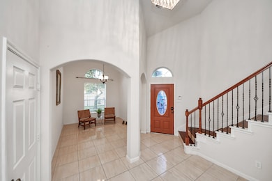 Soft, neutral tones adorn the walls and high ceili