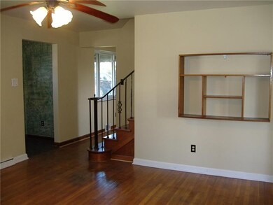Living room, HW floors and hardwood staircase to u