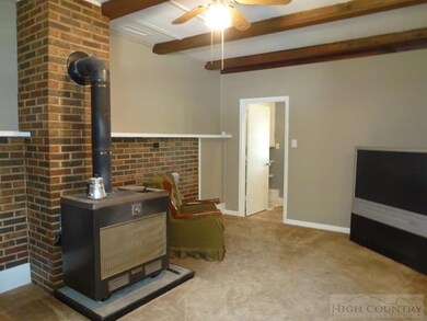 The family room is warmed by a wood-burning stove.