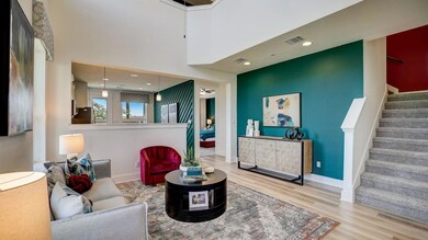 Living room featuring wood finished floors, stair