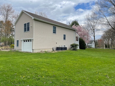 Side yard with 1 car garage in the back.