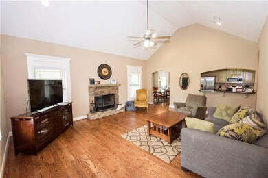 Great Room with vaulted ceiling, hardwoods and woo