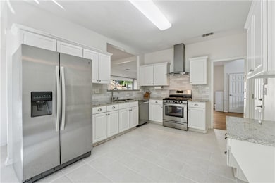Kitchen featuring appliances with stainless steel 