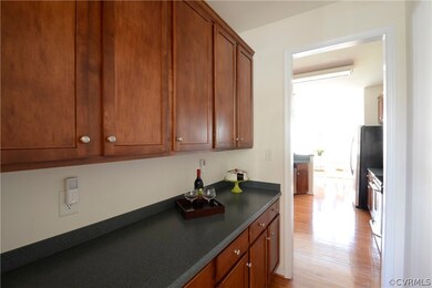 Butler's pantry with solid surface countertop & up