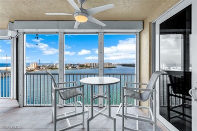 Sunroom featuring a water view, a healthy amount o