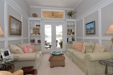 living room with crown molding with rope lighting