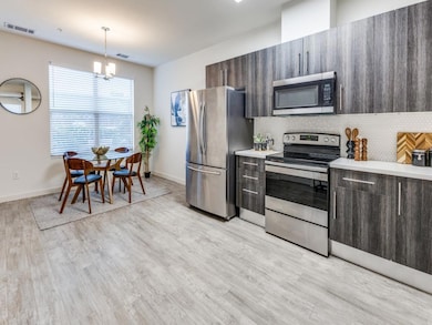 Kitchen featuring an inviting chandelier, light w