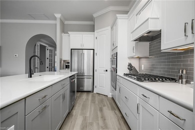 Kitchen includes upgraded cabinetry with soft close cabinets and pull out shelving, island also features additional storage on each end.