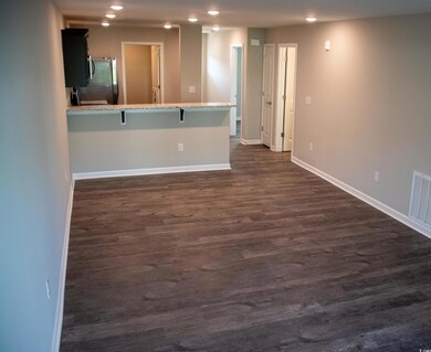 Spare room featuring dark hardwood / wood-style fl