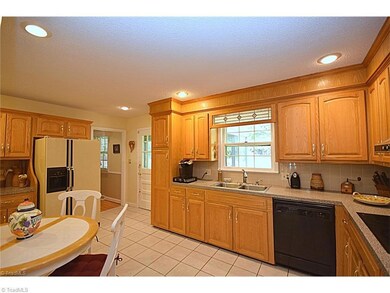 Kitchen, left door leads to the DR, right door to the sunroom.