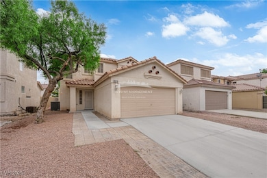 Mediterranean / spanish-style home featuring stucco siding, concrete driveway, a tile roof, and an attached garage
