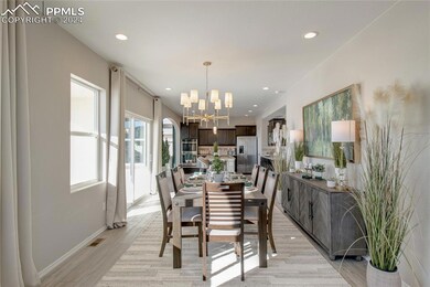 Dining space featuring a chandelier and light hard