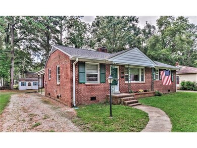 Front view - Sidewalk, gutters, lamppost, front stoop, shed, off street parking, BRICK!, dimensional roof