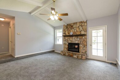 Den with Fireplace-cathedral Ceiling