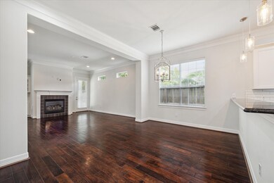An open concept layout with hardwood floors throug
