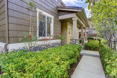 Front path and porch. Low seating wall perfect for