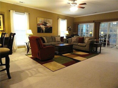Spacious living room with ceiling fan. The Screen Porch has durable plastic windows that lower and raise, so the seller will leave the sliding glass doors open during most seasons.  