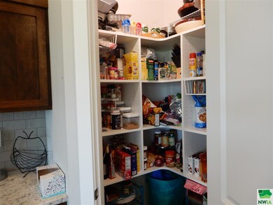 Large pantry in the kitchen area (shown with food 