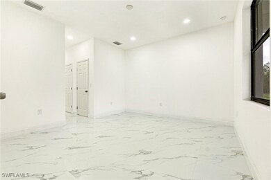 Unfurnished room with recessed lighting and light