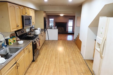Kitchen featuring stainless steel appliances, ligh