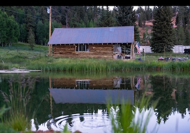 Cabin Reflection on Pond