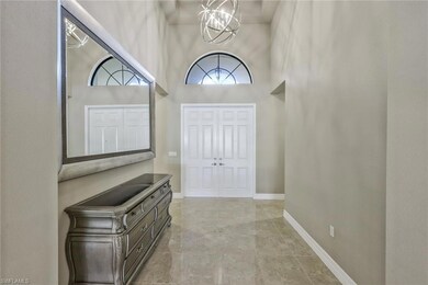 Foyer with a high ceiling and a chandelier