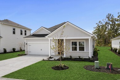 Modern farmhouse style home with driveway, brick s