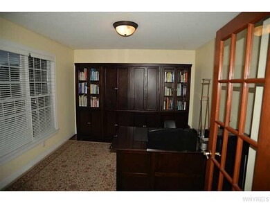 Den Hardwood floor and French Doors