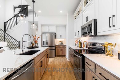 Kitchen featuring decorative backsplash, stainles