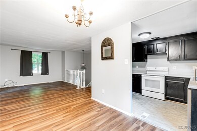 Kitchen featuring a chandelier, white electric ran