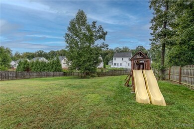 The backyard is fenced and spacious.