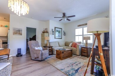 Living room with light wood-type flooring and ceil