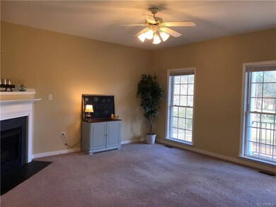 Lovely living room with floor to ceiling windows a