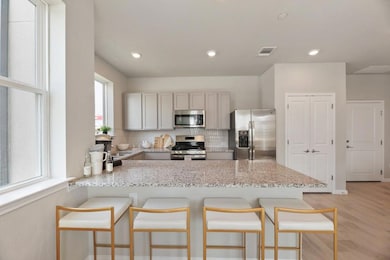 Kitchen featuring stainless steel appliances, a p