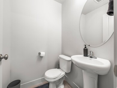 Half bathroom featuring baseboards