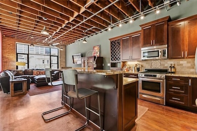 Kitchen with a kitchen breakfast bar, track light