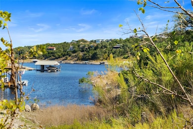 Water view with boat lift and a boat dock