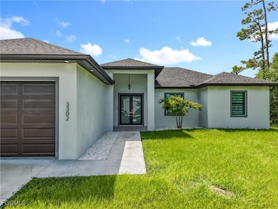 3302 E 3rd St, Lehigh Acres, FL 33936 - photo 2