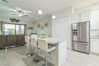 Kitchen with stainless steel fridge with ice dispe