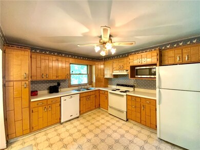 Fully Equipped Kitchen with Plenty of Cabinets