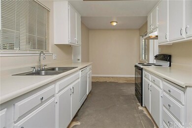 Charming kitchen with white cabinets and a breakfa