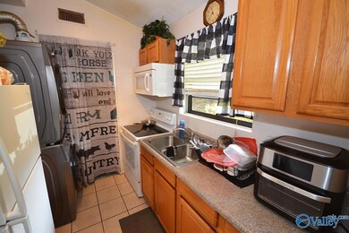 There's a spacious pantry, refrigerator, stove, bu