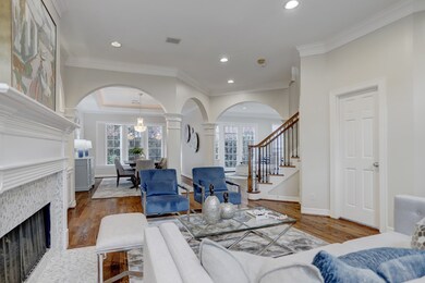 The living and dining room flow seamlessly into the family, breakfast and kitchen area allowing for warm gatherings with friends and family.