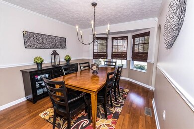 To the right of the foyer is the spacious, brightl