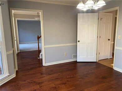 Unfurnished bedroom featuring dark hardwood / wood