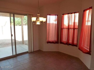 Dining features doors leading to patio