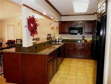 Stunning renovated Kitchen offers rich Cherry cabi