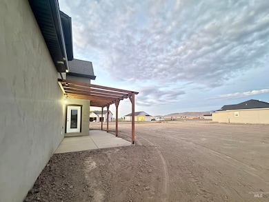 View of yard featuring a patio and a residential view